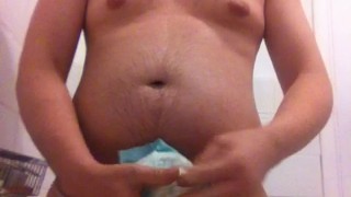 chav in golden shower wanking in piss soaked nappy